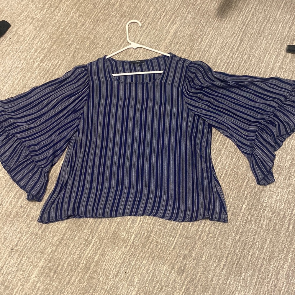 Navy and white striped top. Wide sleeves.